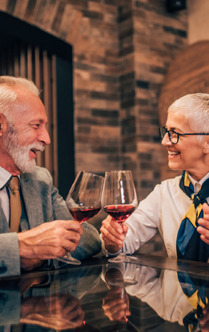 Over 50s healthy couple with glasses of wine